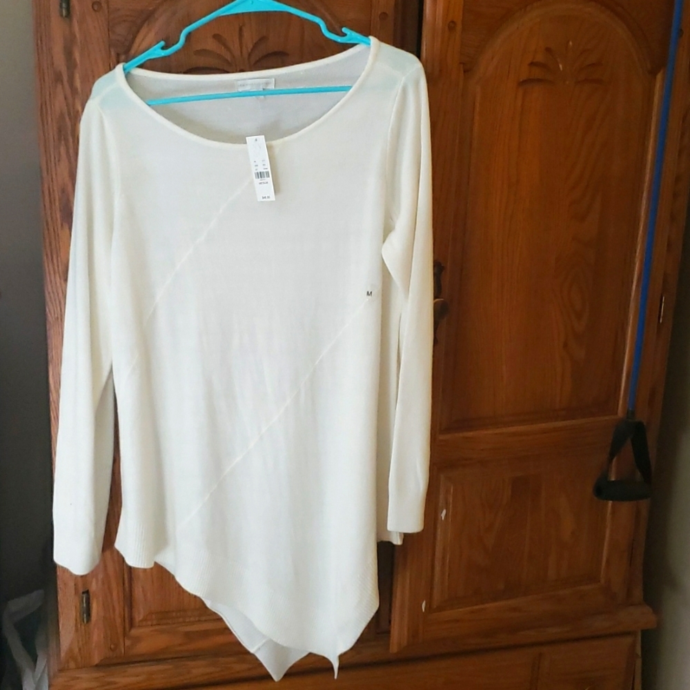 Cream  colored diagional top